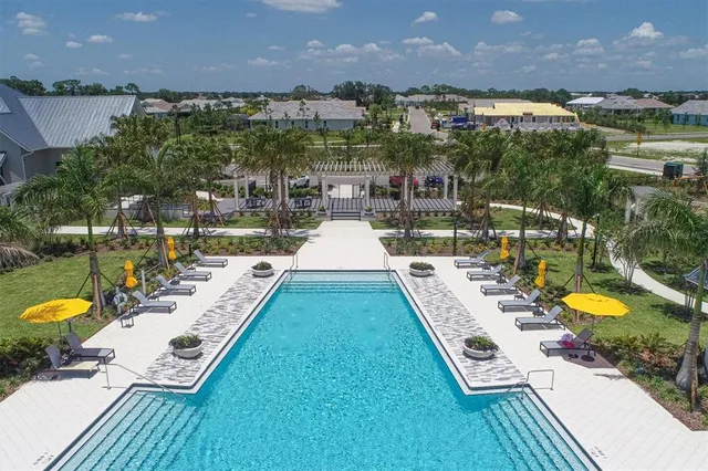 an aerial view of a house with a ocean view