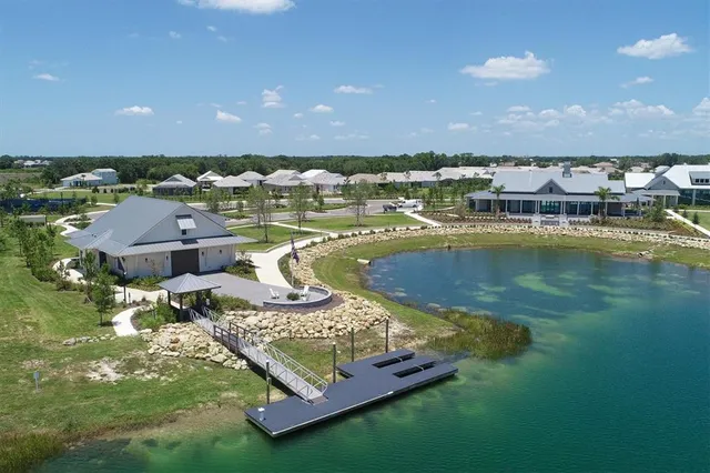 an aerial view of a house with a lake view