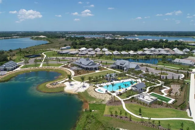 a view of a porch with furniture and a yard