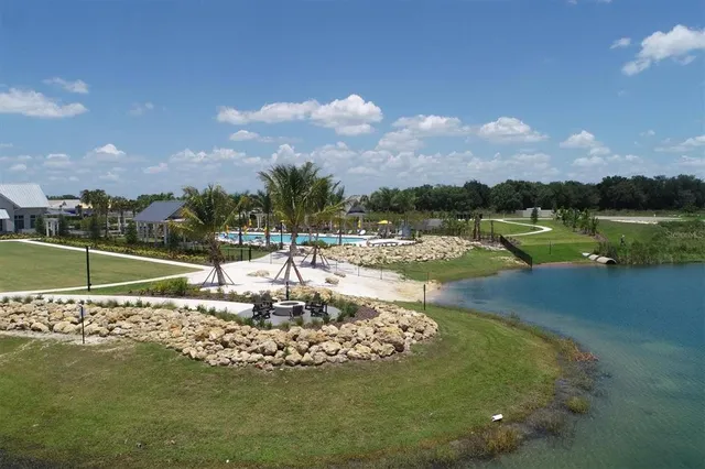 a view of a patio with a table and chairs