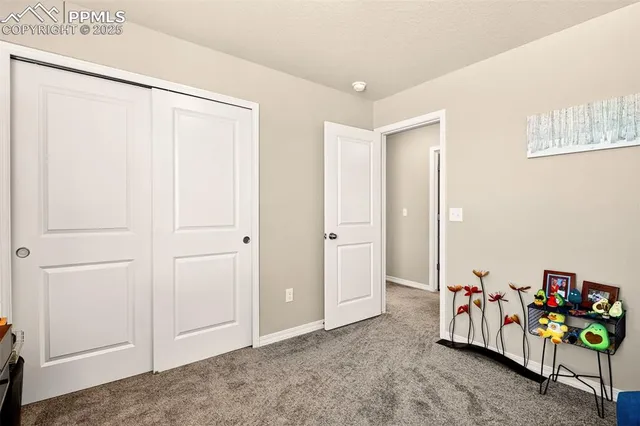 a bedroom with a bed and a ceiling fan