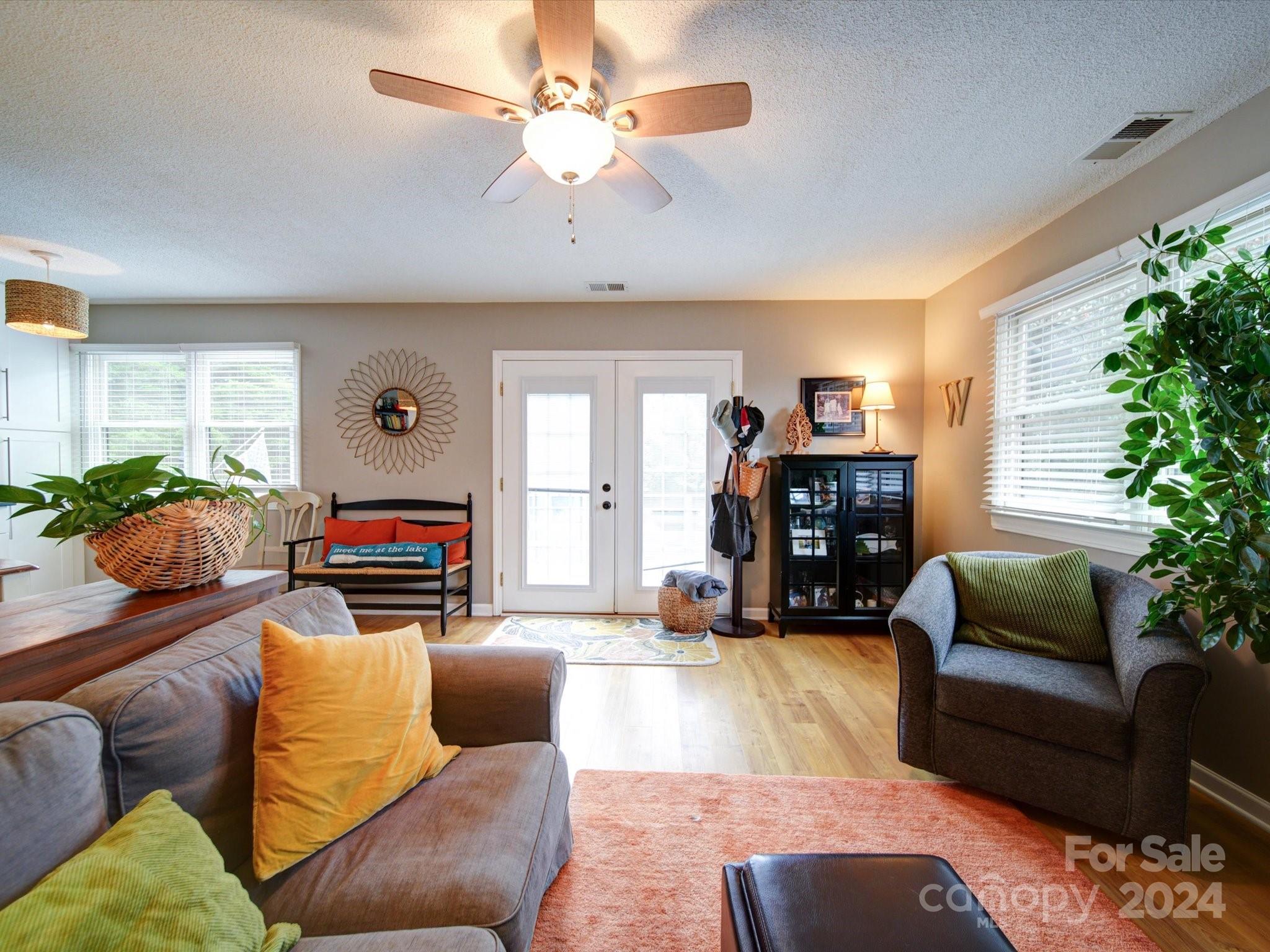 20126 Rainbow Circle Cornelius, NC 28031 - Photo 12 of 40 a living room with furniture and a fireplace