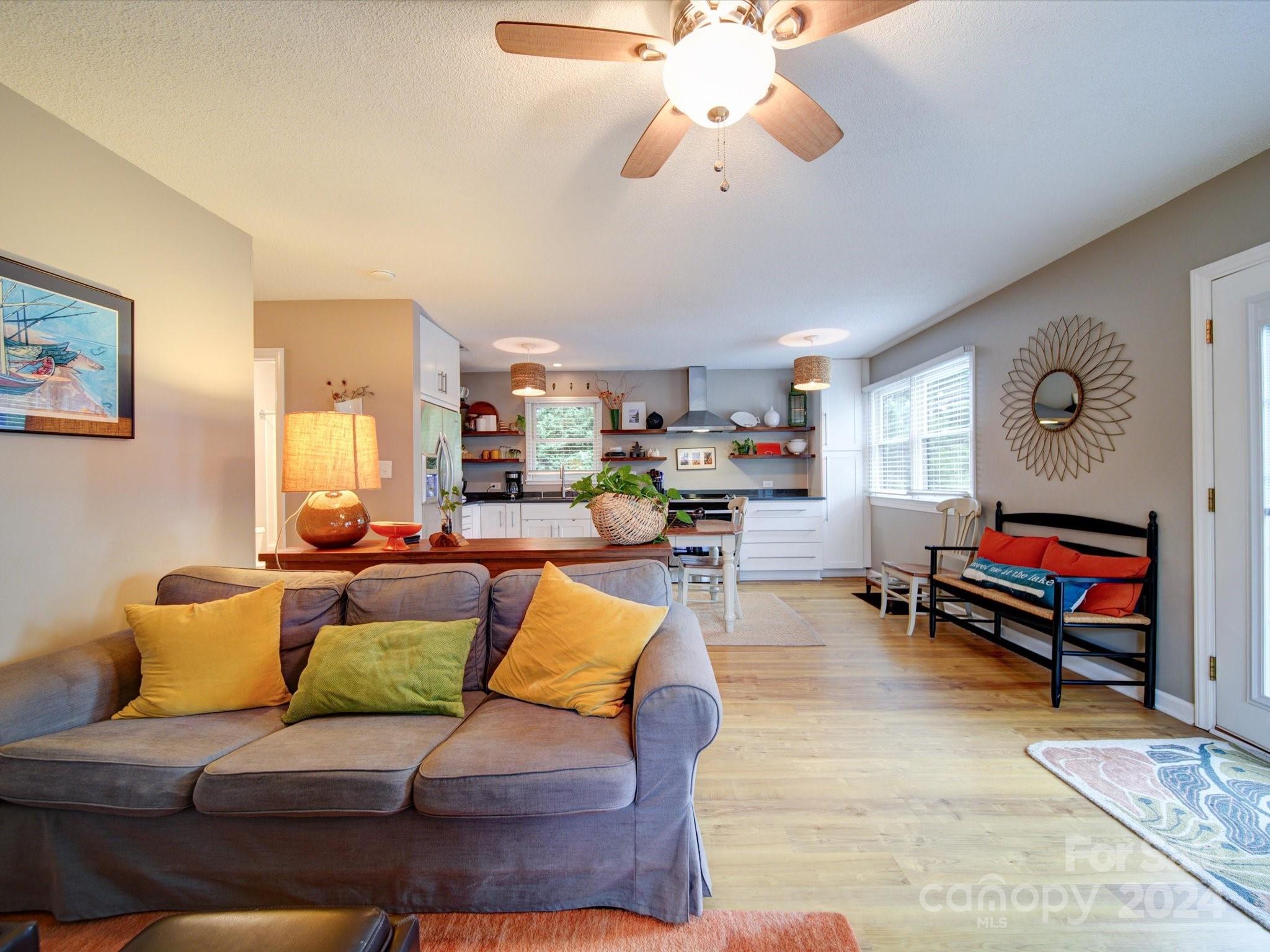 20126 Rainbow Circle Cornelius, NC 28031 - Photo 13 of 40 a living room with furniture and a flat screen tv