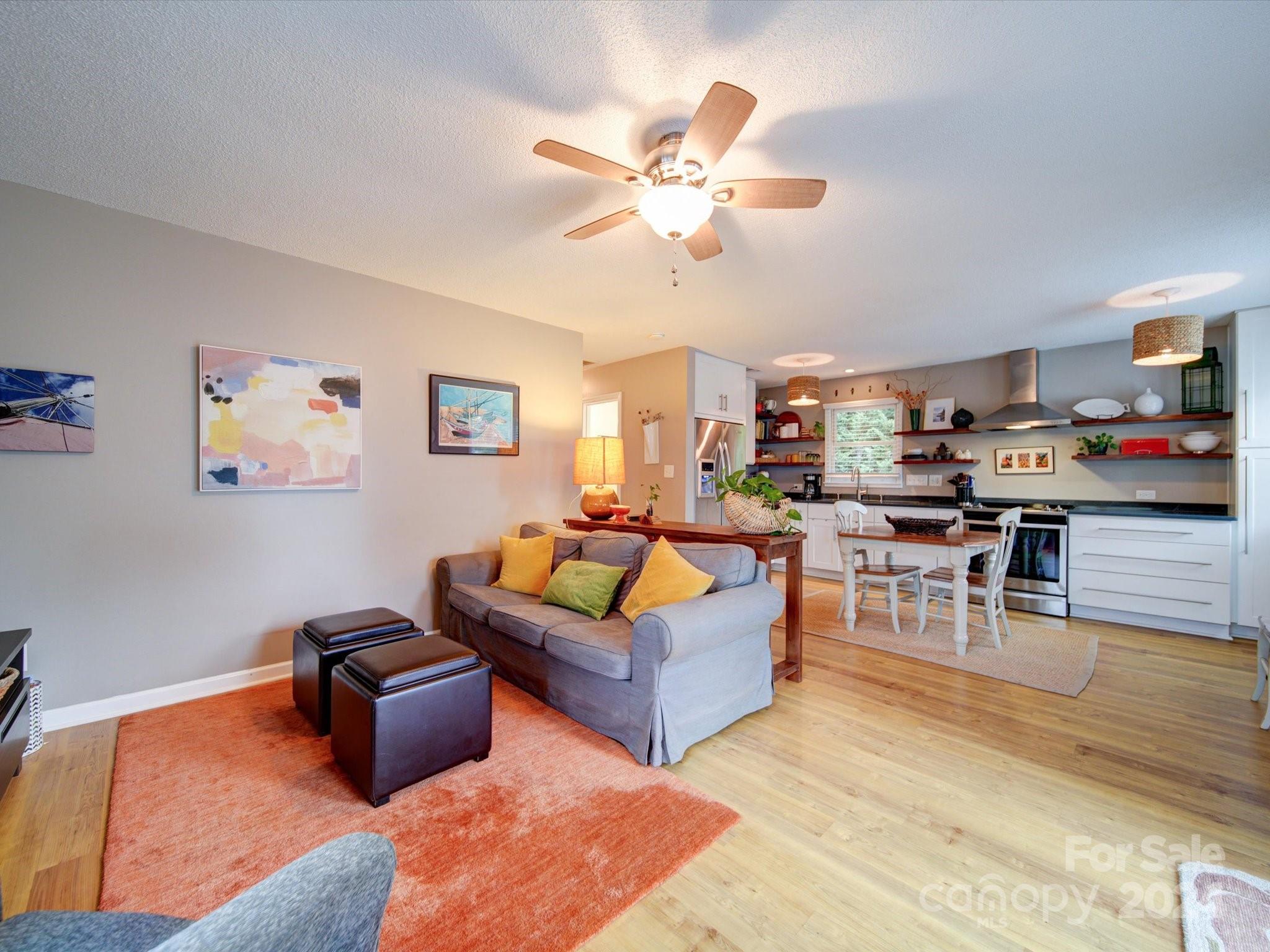 20126 Rainbow Circle Cornelius, NC 28031 - Photo 14 of 40 a living room with furniture kitchen view and a table