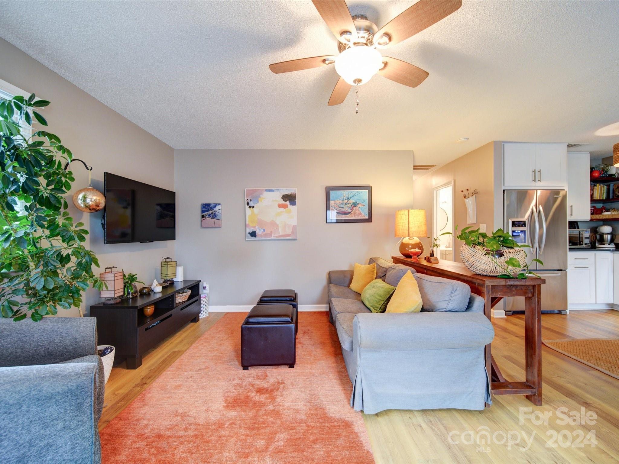 20126 Rainbow Circle Cornelius, NC 28031 - Photo 15 of 40 a living room with furniture and a flat screen tv