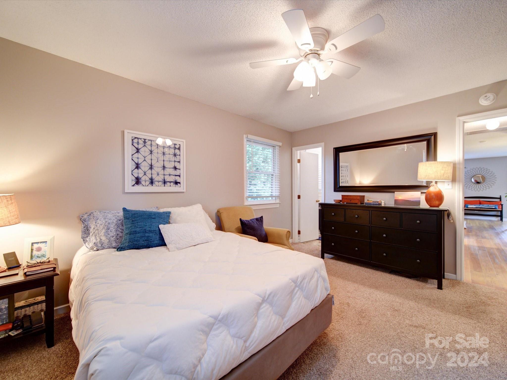 20126 Rainbow Circle Cornelius, NC 28031 - Photo 17 of 40 a bedroom with a bed and a flat screen tv