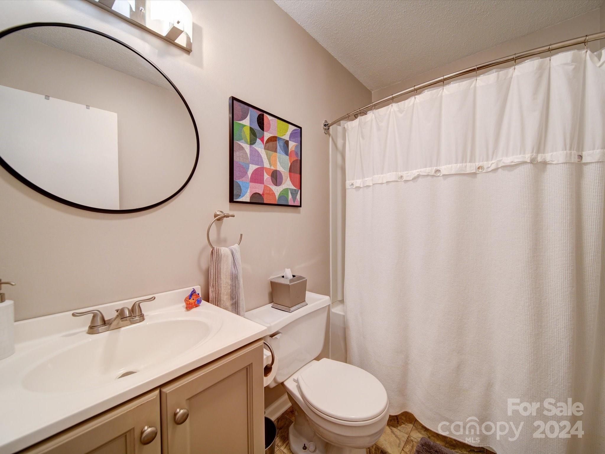 20126 Rainbow Circle Cornelius, NC 28031 - Photo 25 of 40 a bathroom with a sink and a mirror