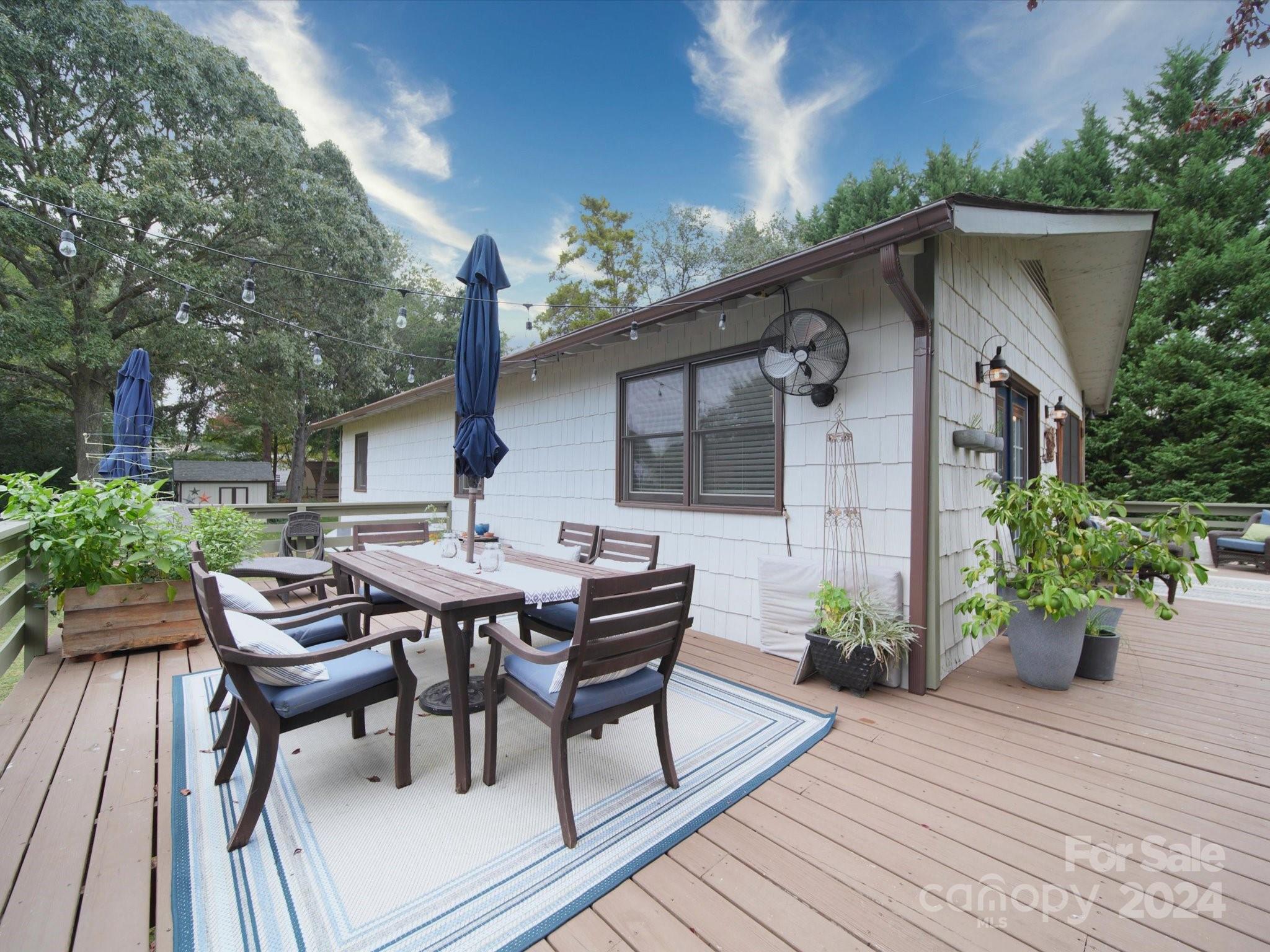 20126 Rainbow Circle Cornelius, NC 28031 - Photo 26 of 40 a view of a dinning table and chairs in patio of the house