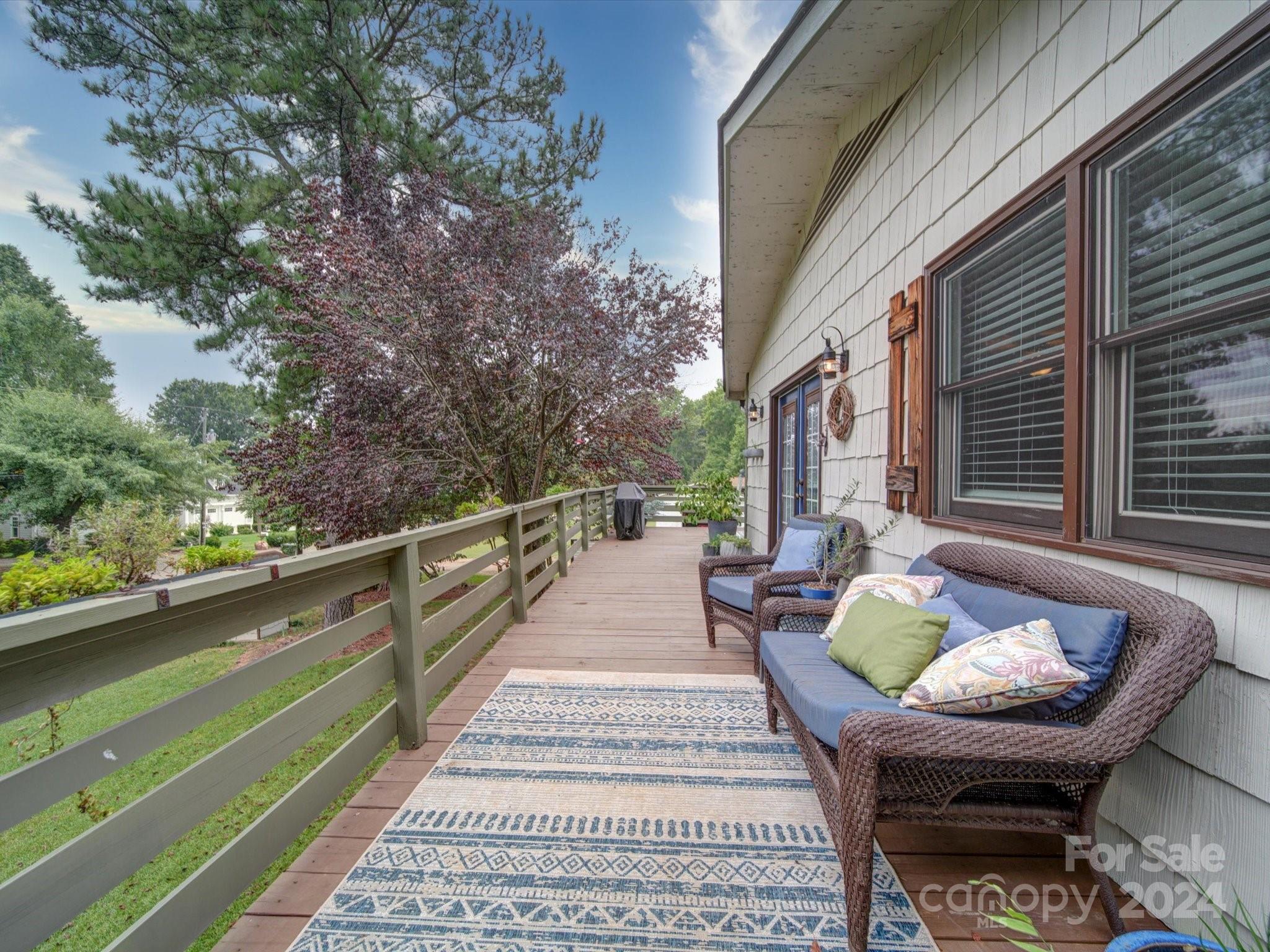 20126 Rainbow Circle Cornelius, NC 28031 - Photo 28 of 40 a balcony with furniture and a potted plant