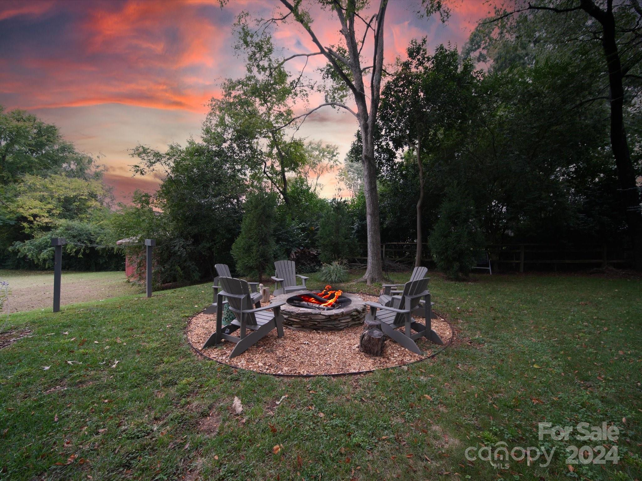 20126 Rainbow Circle Cornelius, NC 28031 - Photo 30 of 40 a backyard of a house with table and chairs