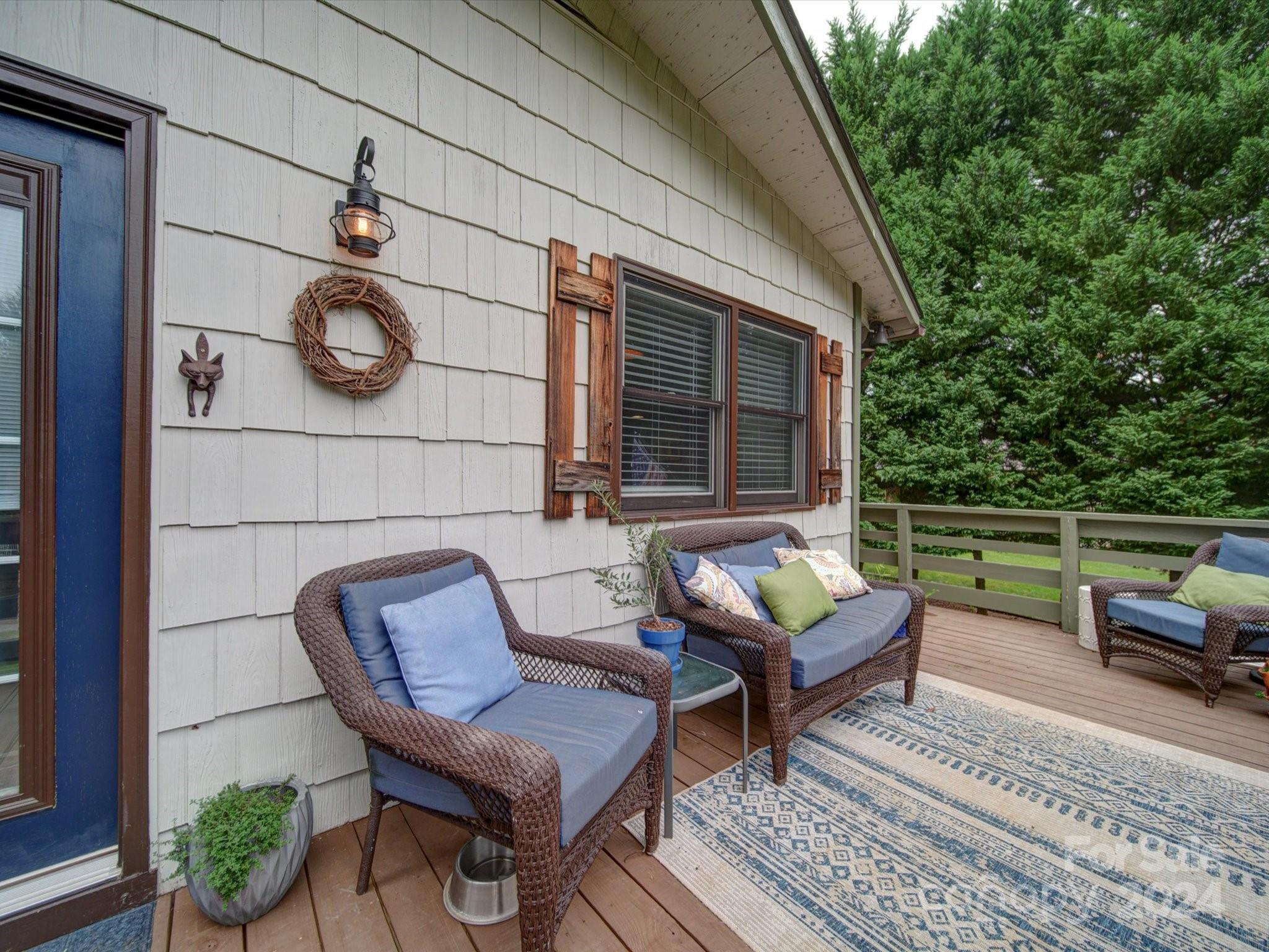 20126 Rainbow Circle Cornelius, NC 28031 - Photo 40 of 40 a backyard of a house with barbeque oven table and sofas