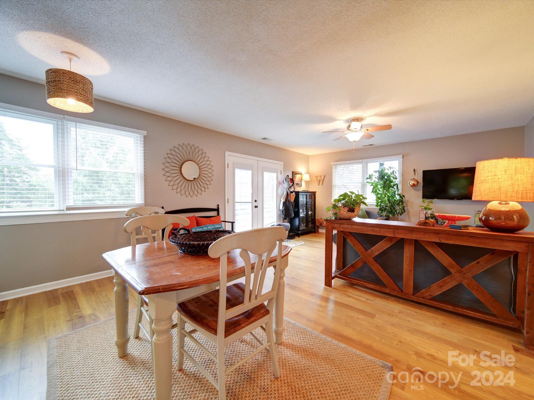 20126 Rainbow Circle Cornelius, NC 28031 - Photo 4 of 40 a living room with furniture and a flat screen tv