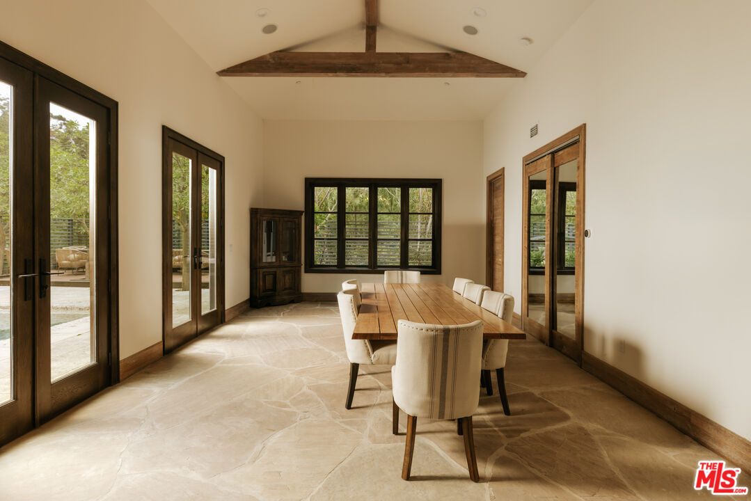 1105 Rivas Canyon Road Pacific Palisades, CA 90272 - Photo 47 of 49 a view of a dining room with furniture and a window