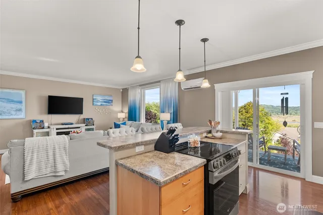 a view of living room with furniture and flat screen tv