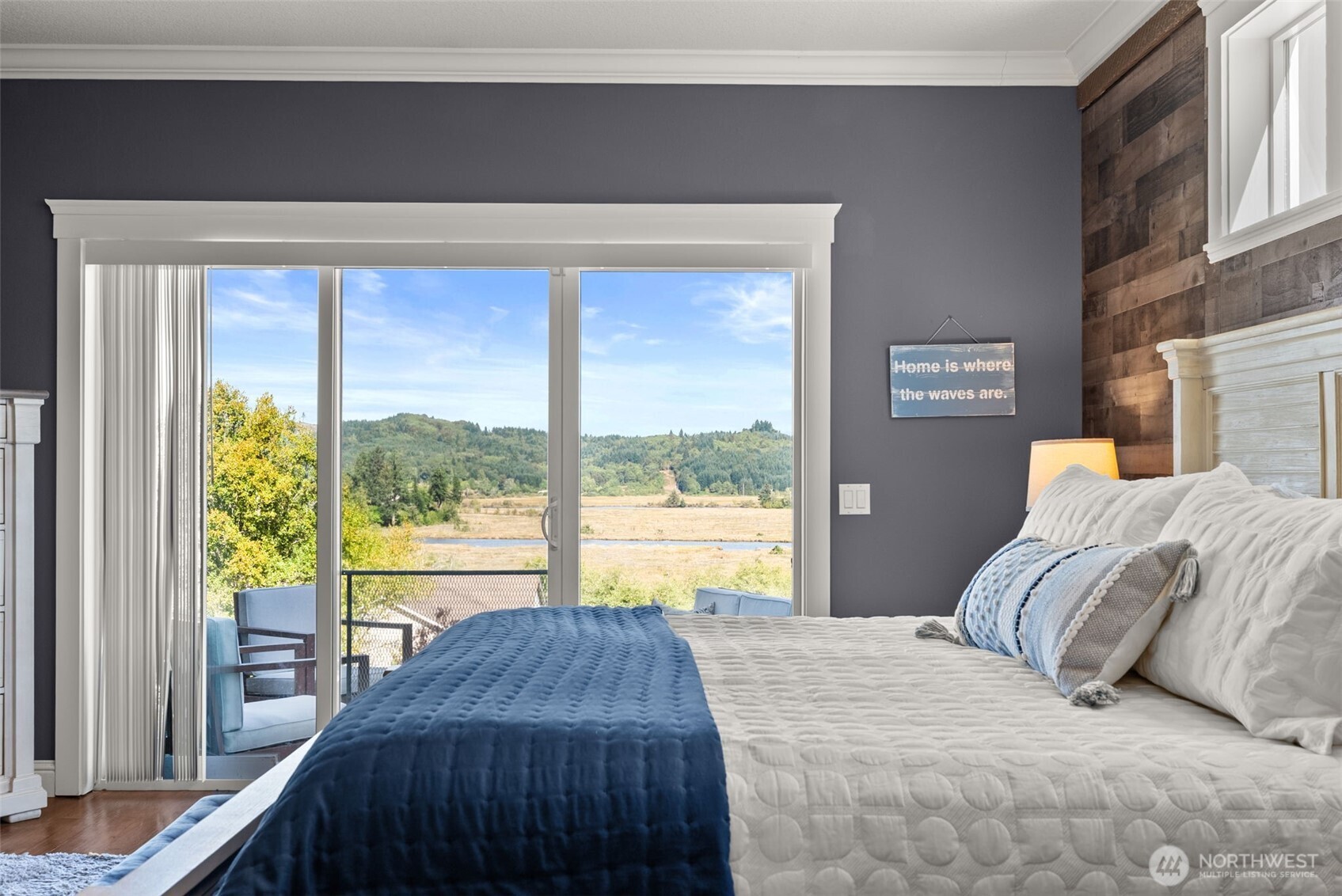 1480 Pacific Avenue Raymond, WA 98577 - Photo 14 of 40 a bedroom with a bed and a large window