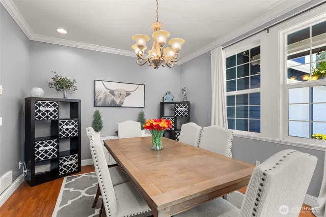 a dining room with furniture and window