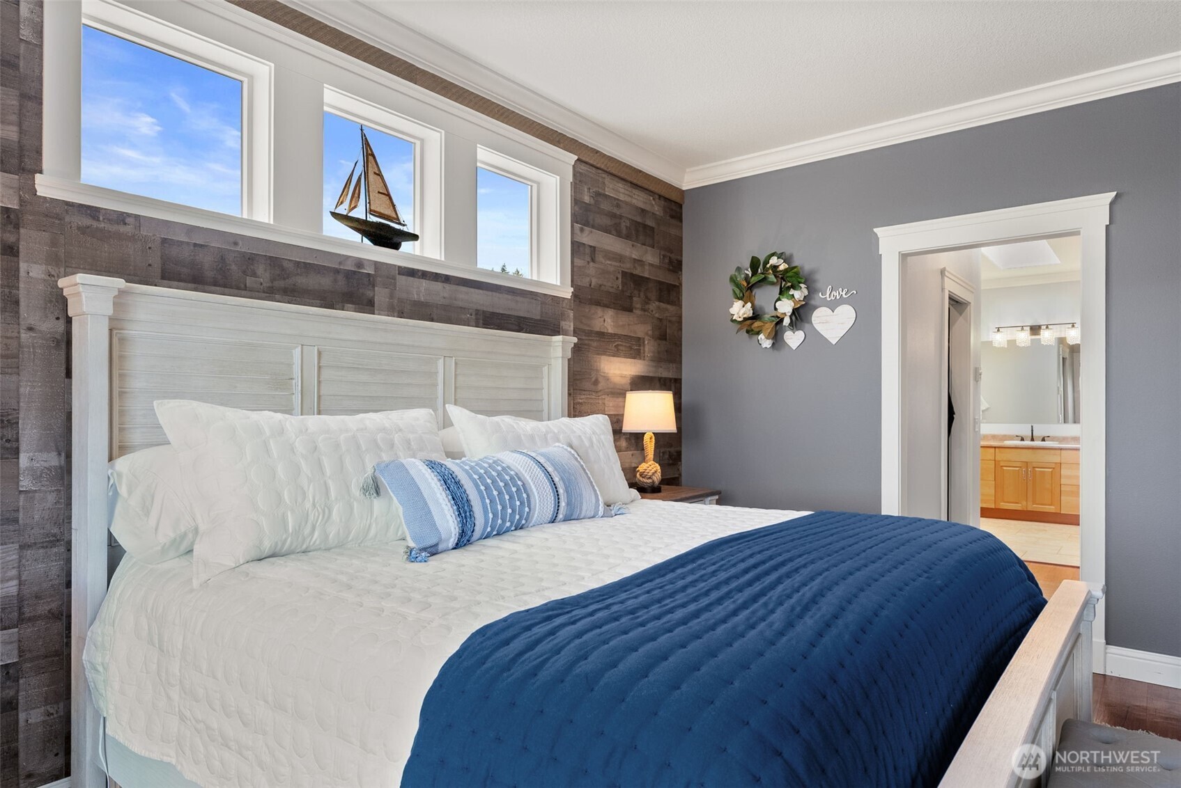 1480 Pacific Avenue Raymond, WA 98577 - Photo 15 of 40 a bedroom with a bed and painting on the wall