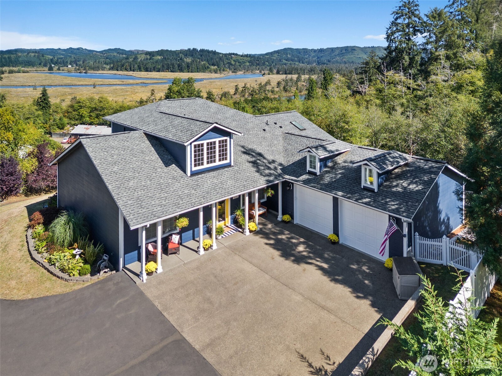 1480 Pacific Avenue Raymond, WA 98577 - Photo 29 of 40 an aerial view of a house with a garden and lake view