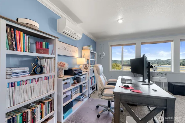 a work room with furniture and a book shelf