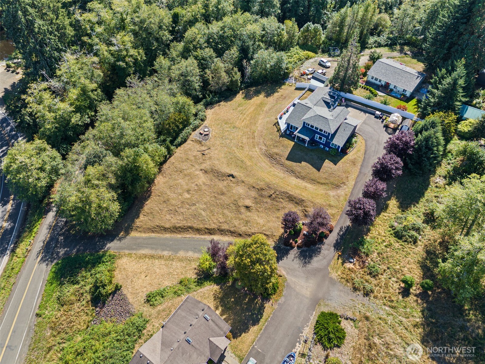 1480 Pacific Avenue Raymond, WA 98577 - Photo 38 of 40 an aerial view of a house with a yard and lake view
