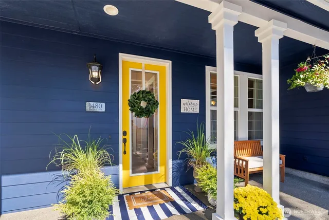 a view of front door of house and potted plant