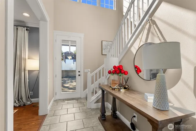 a bathroom with a granite countertop sink a mirror and vanity