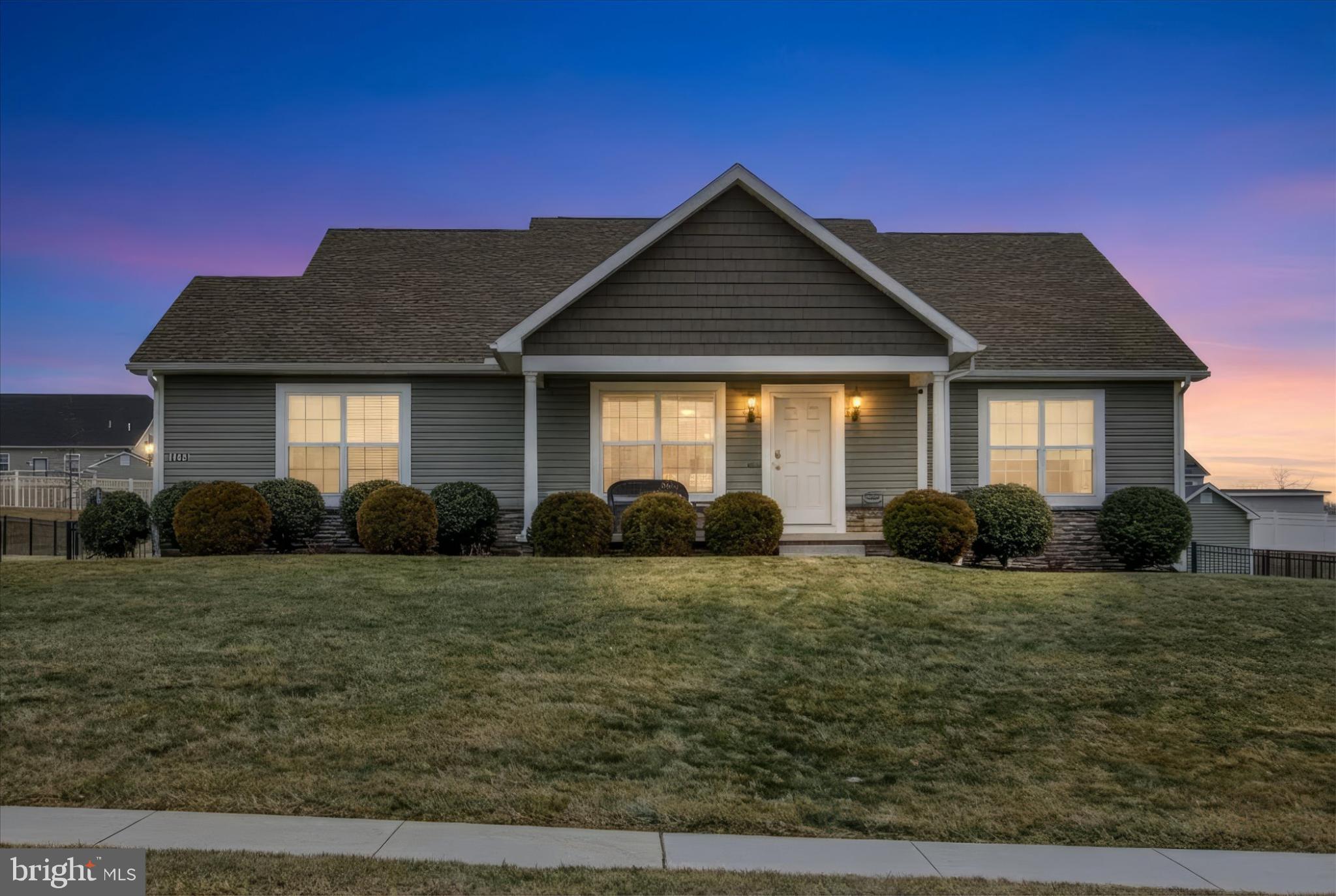 Charming home at twilight, inviting warmth.