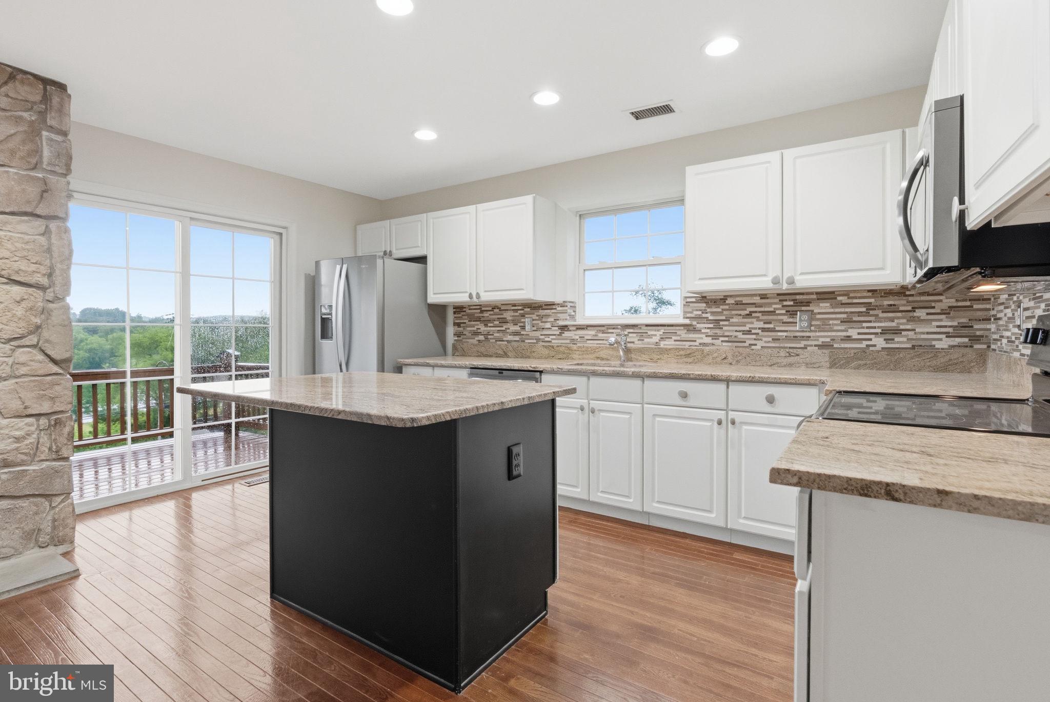1400 Harbour Ridge Lane Downingtown, PA 19335 - Photo 12 of 36 Kitchen with slider to deck