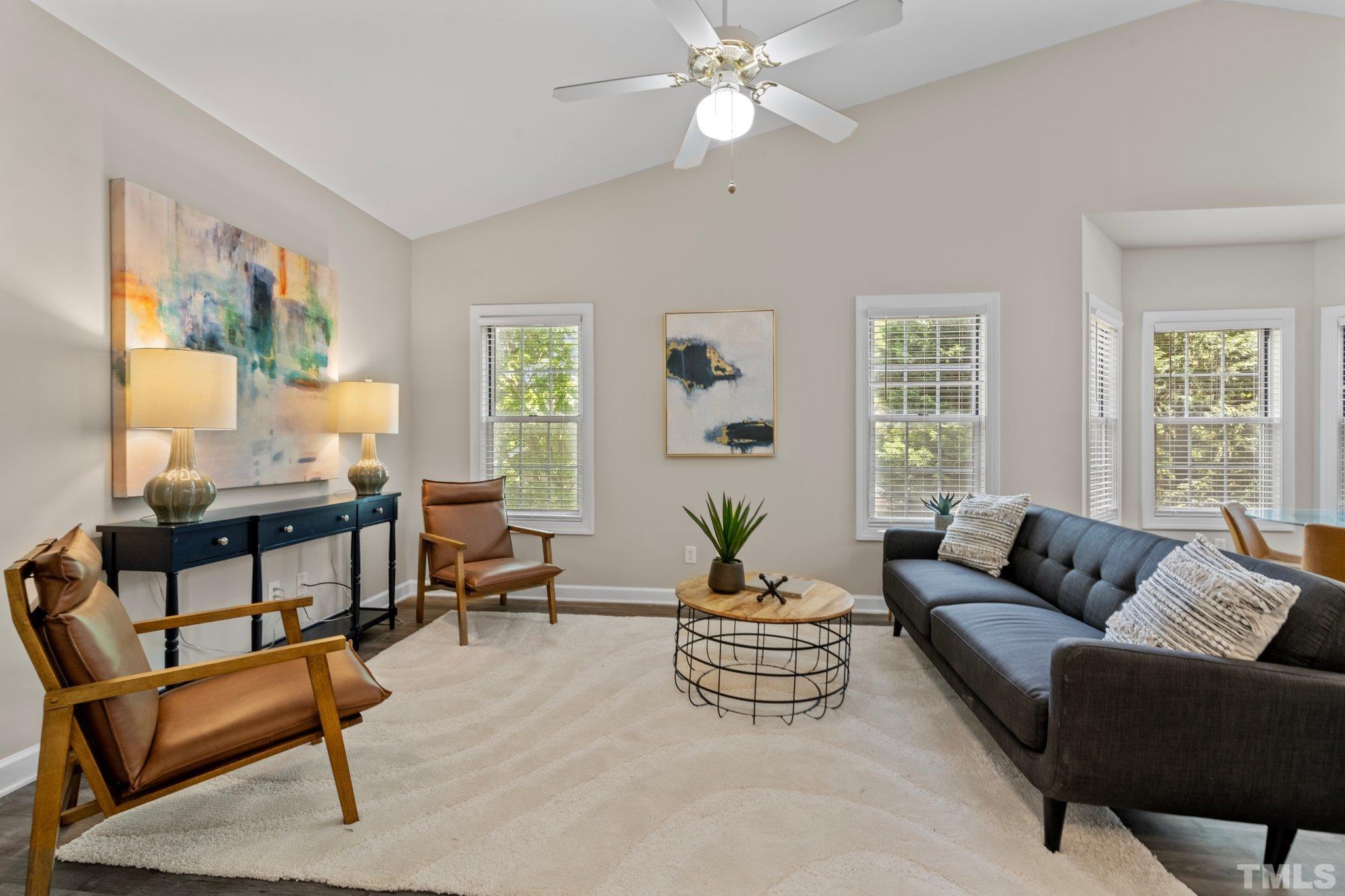 7024 Sandy Forks Road, Unit 302 Raleigh, NC 27615 - Photo 3 of 24 a living room with furniture and a large window