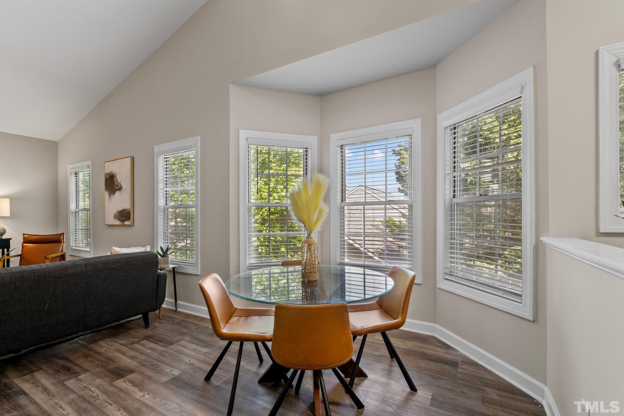 7024 Sandy Forks Road, Unit 302 Raleigh, NC 27615 - Photo 8 of 24 a dining room with furniture and windows