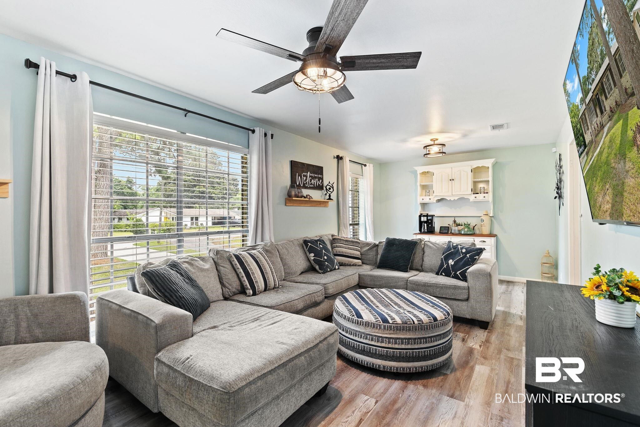 14 Lee Circle Daphne, AL 36527 - Photo 20 of 83 Living room with ceiling fan, plenty of natural light, and hardwood / wood-style flooring