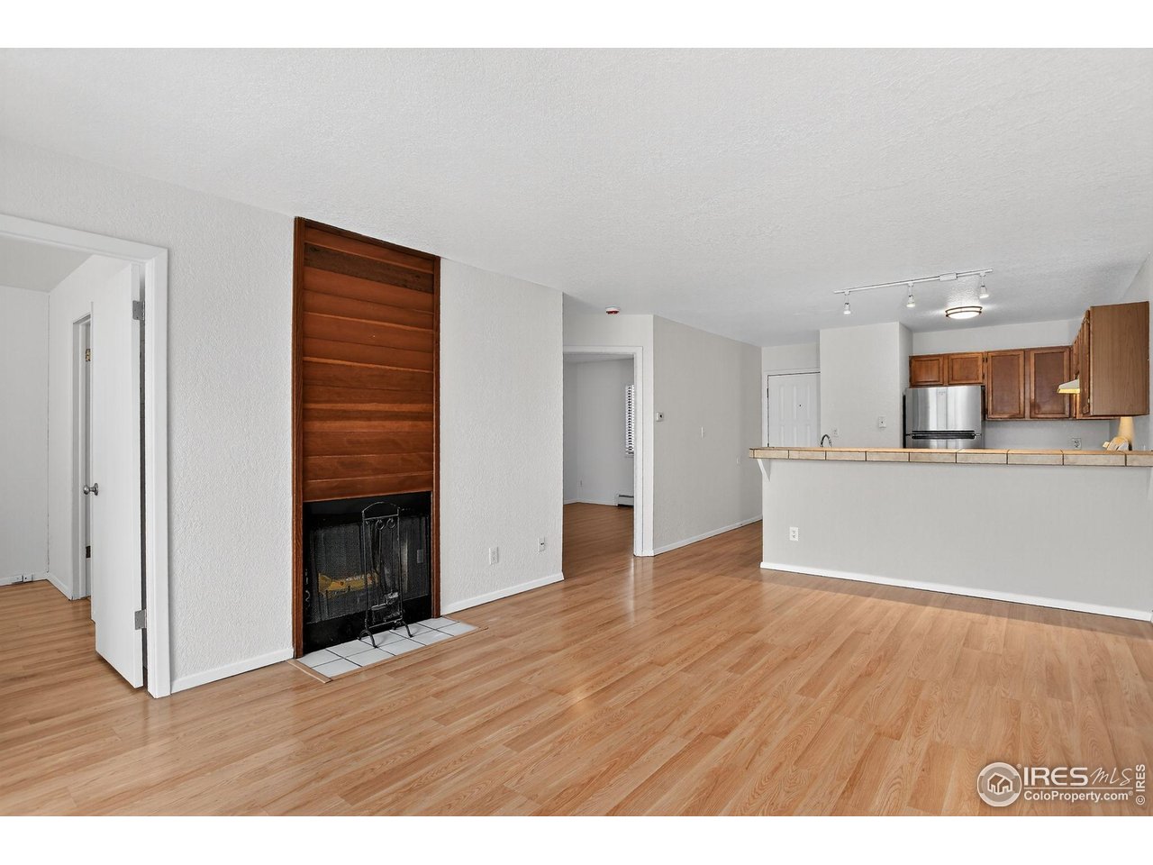 3535 28th Street, Unit 202 Boulder, CO 80301 - Photo 11 of 31 a view of kitchen with livingroom and wooden floor