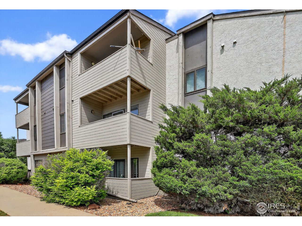 3535 28th Street, Unit 202 Boulder, CO 80301 - Photo 16 of 31 a view of a house with a yard