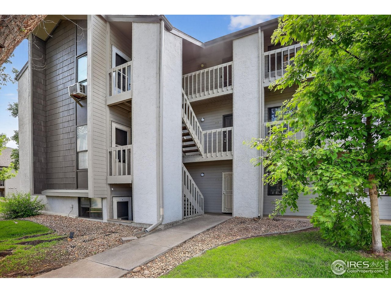 3535 28th Street, Unit 202 Boulder, CO 80301 - Photo 2 of 31 a view of front of house with a yard