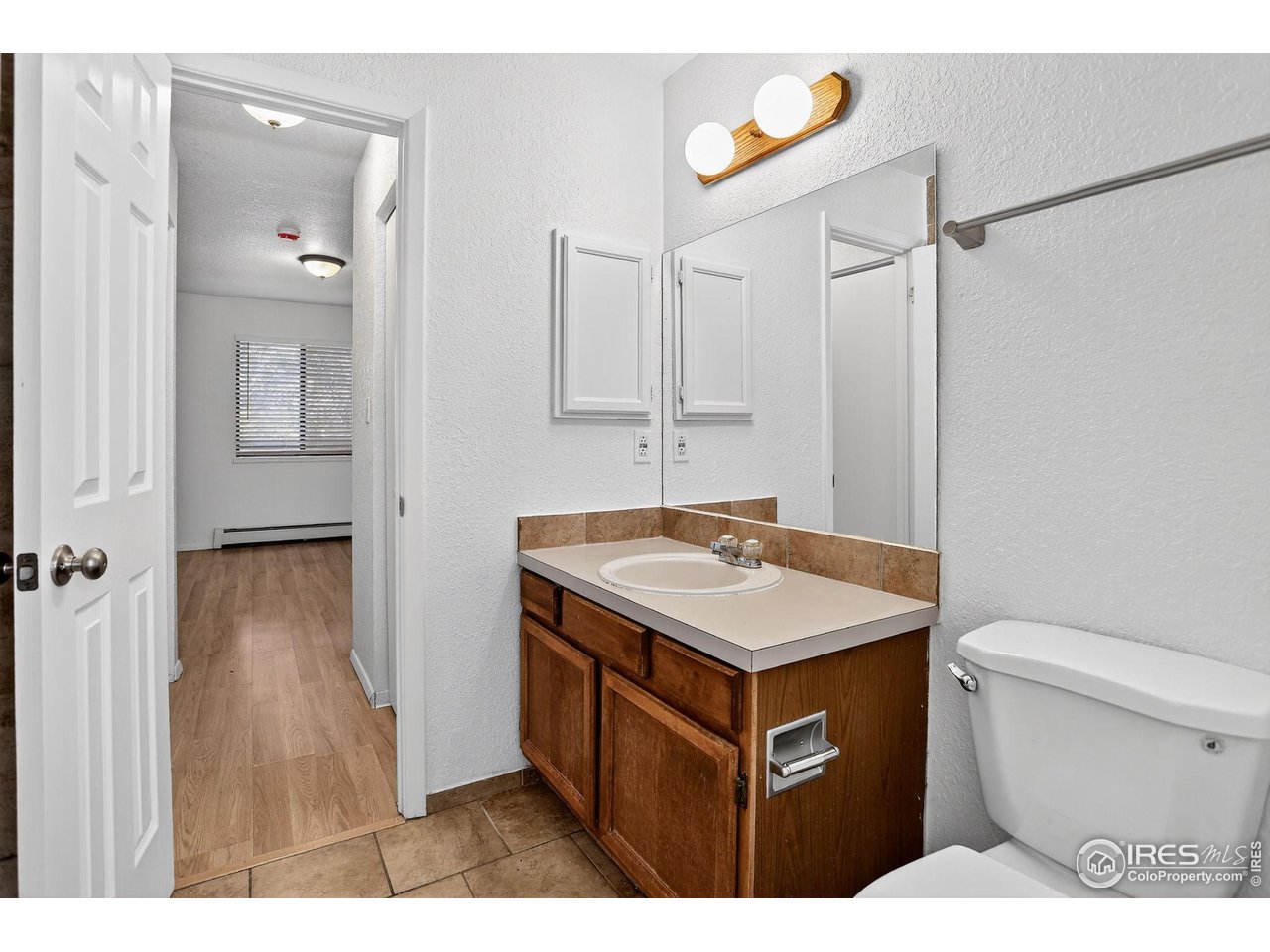 3535 28th Street, Unit 202 Boulder, CO 80301 - Photo 22 of 31 a bathroom with a sink toilet and shower