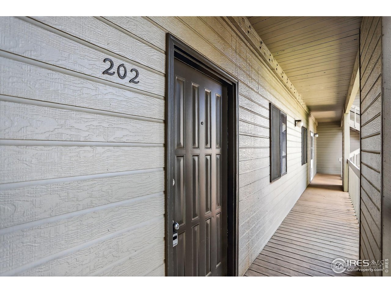 3535 28th Street, Unit 202 Boulder, CO 80301 - Photo 3 of 31 a view of a door and wooden floor