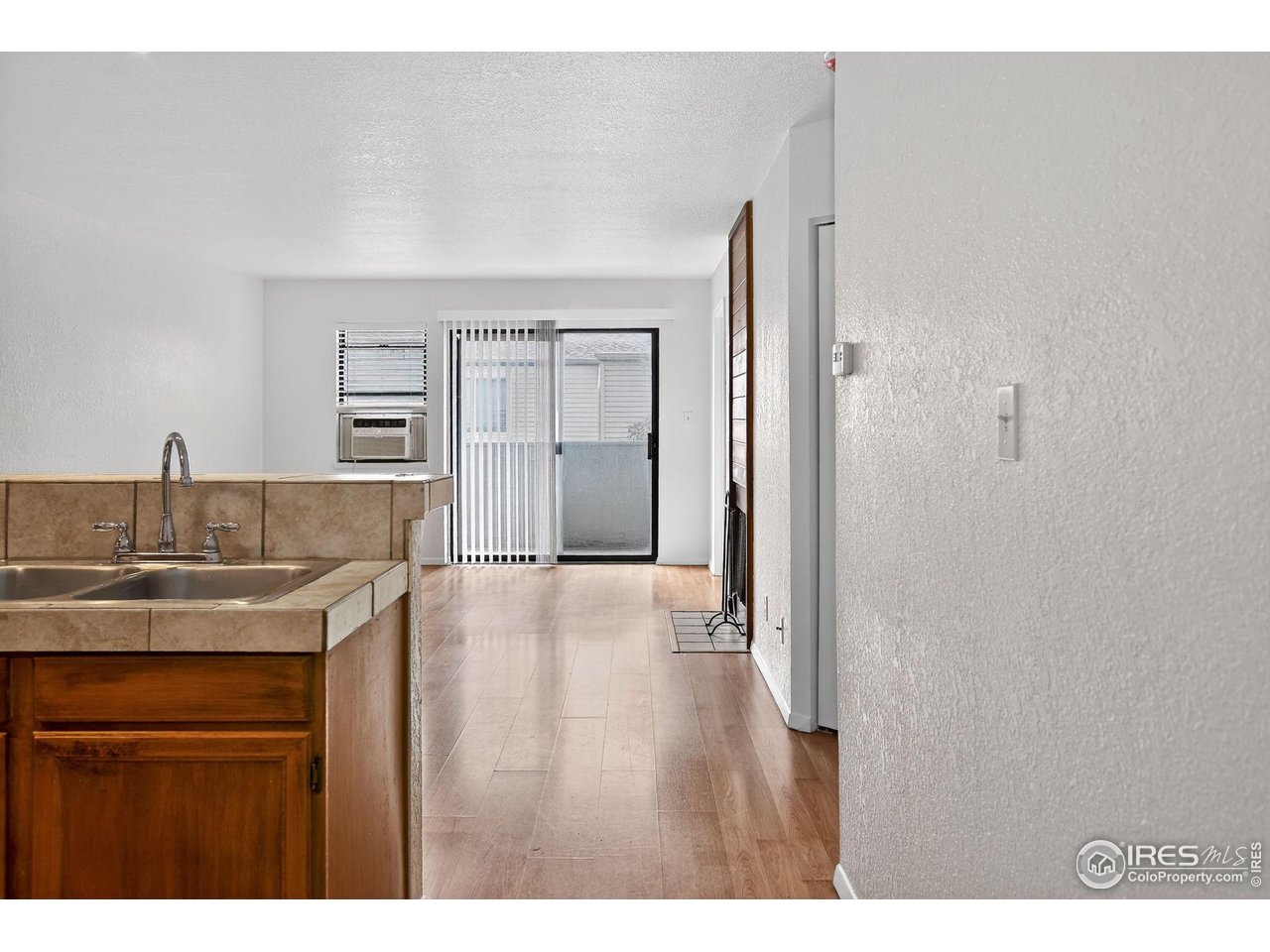 3535 28th Street, Unit 202 Boulder, CO 80301 - Photo 5 of 31 a kitchen with a sink a refrigerator and cabinets