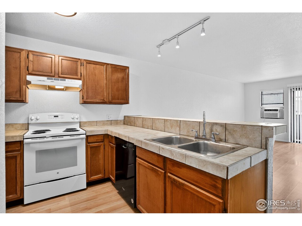 3535 28th Street, Unit 202 Boulder, CO 80301 - Photo 6 of 31 a kitchen with a sink stove and cabinets