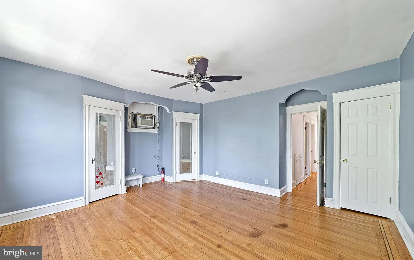 2329 Rhawn Street Philadelphia, PA 19152 - Photo 17 of 23 a view of a livingroom with wooden floor and a ceiling fan