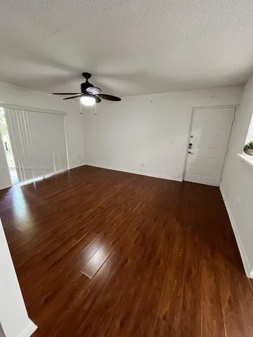 wooden floor in a hall with an entryway