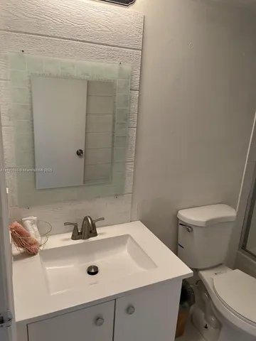 a bathroom with a sink and a toilet