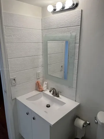 a bathroom with a sink and a toilet