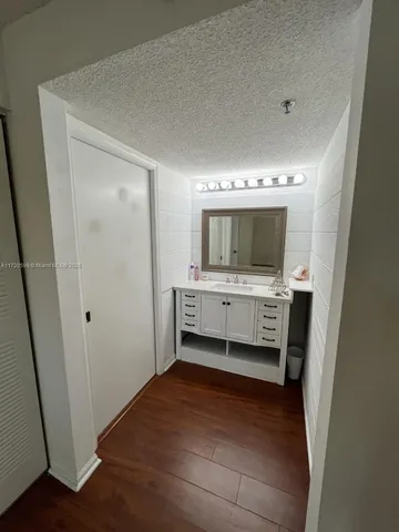a bathroom with a double vanity sink and mirror