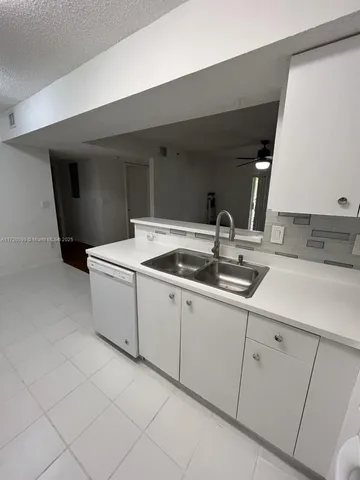 a utility room with cabinets