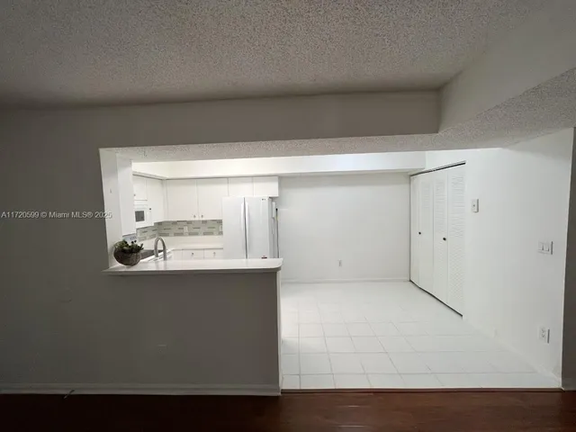 a view of kitchen and kitchen island