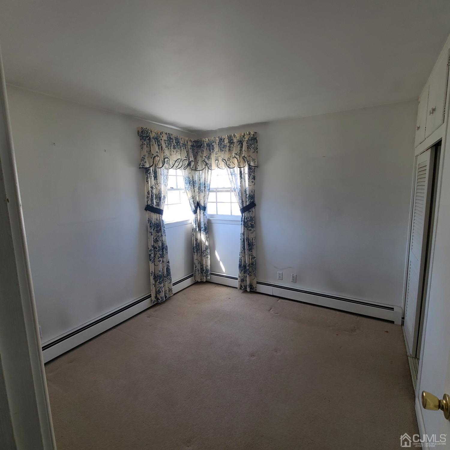 3 Stiles Road Edison, NJ 08817 - Photo 13 of 30 an empty room with windows and refrigerator