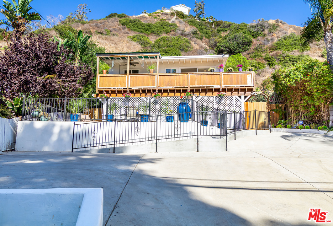 3938 Las Flores Canyon Road Malibu, CA 90265 - Photo 1 of 21 a view of a building with a outdoor space