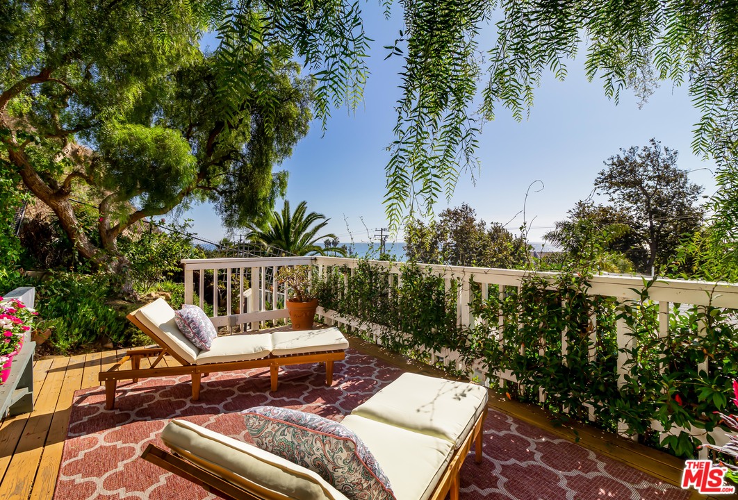 3938 Las Flores Canyon Road Malibu, CA 90265 - Photo 14 of 21 a view of a chairs and table on the terrace