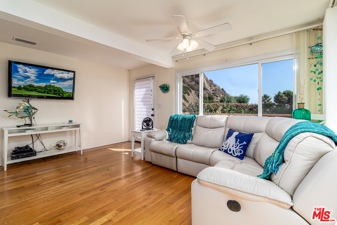 3938 Las Flores Canyon Road Malibu, CA 90265 - Photo 3 of 21 a living room with furniture and a flat screen tv