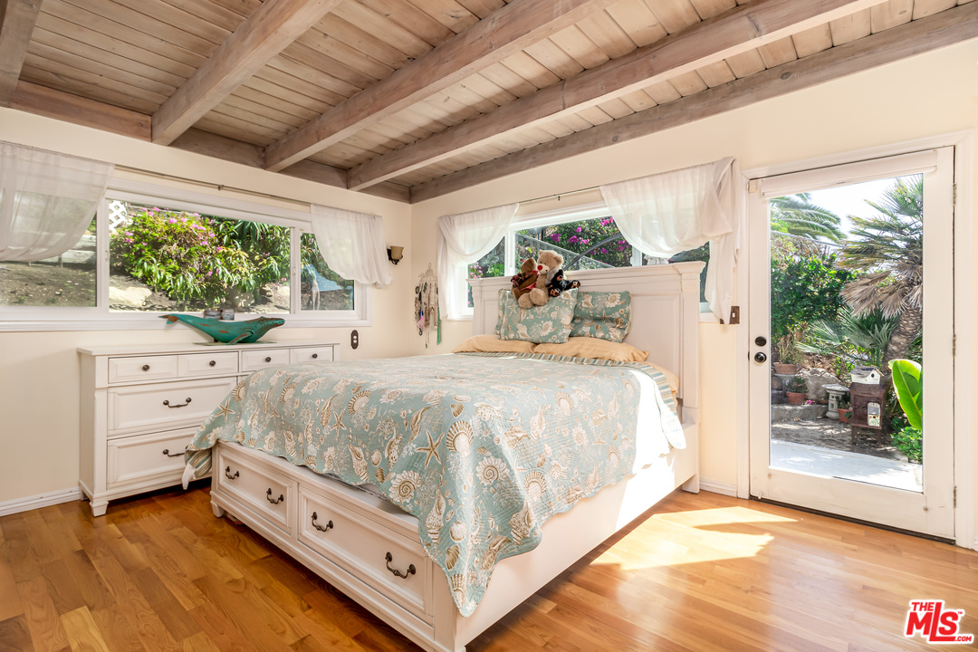 3938 Las Flores Canyon Road Malibu, CA 90265 - Photo 5 of 21 a bed room with a bed and a window